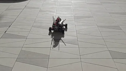 Sentra mobile robot driving across an outdoor paved plaza